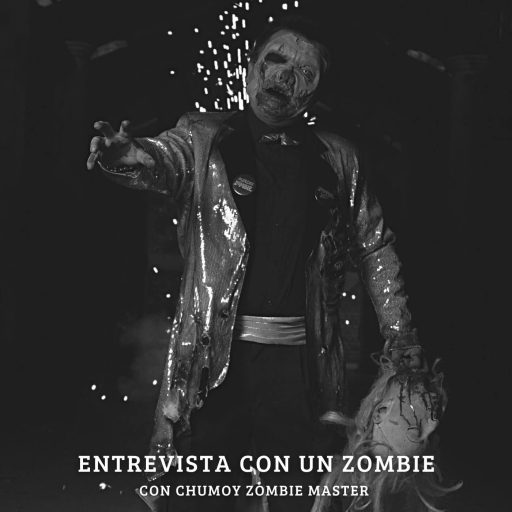 Chumoy Zombie Master con traje y con una cabeza en la mano, alzando la mano para atraparte